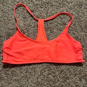 Bright orange bikini top! Stays up very well
